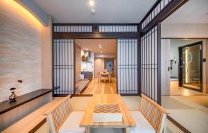 a dining room with a table and chairs at Anran Hotels&Resorts in Osaka