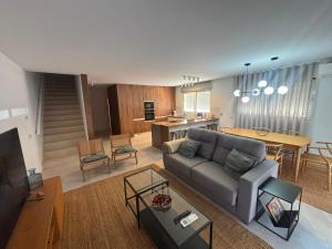 a living room with a couch and a table at Terrace Ferragudo River View Flat Super in Ferragudo