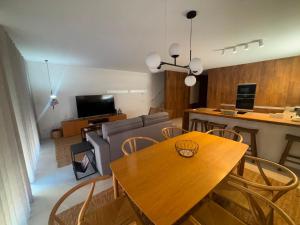 a living room with a table and a couch at Terrace Ferragudo River View Flat Super in Ferragudo