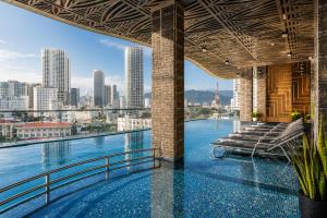 a swimming pool with a view of the city at W Premium Nha Trang in Nha Trang