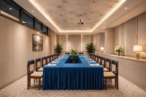 a conference room with a long table and chairs at W Premium Nha Trang in Nha Trang +82 photos