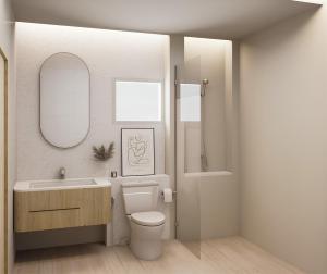 a bathroom with a toilet and a sink and a mirror at Eurana Boutique Hotel in Chiang Mai