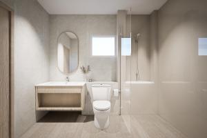 a bathroom with a toilet and a sink and a mirror at Eurana Boutique Hotel in Chiang Mai +59 photos