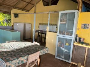 a room with a bedroom with a bed and a counter at Camping Hiva Plage in Parea