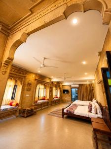 a large room with two beds and a tv at Hotel Tokyo Palace in Jaisalmer +77 photos