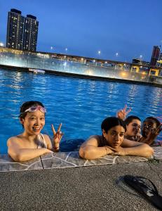 a group of people in the water in a pool at Female Hostel wakakapacker in Kuala Lumpur