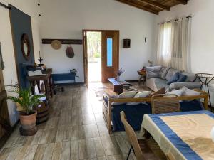 a living room with a couch and a table at Sitio Piruetas in Santana do Livramento +29 photos