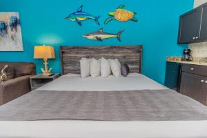 a bedroom with a bed with fishes on the wall at Landmark 618 in Myrtle Beach