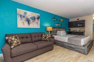 a living room with a bed and a couch at Landmark 618 in Myrtle Beach