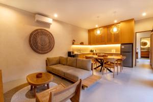a living room with a couch and a table at Coco Luxury Villas in Ubud