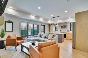 a living room with a couch and a table at 3 Bedroom with Heated Outdoor Pool and Hottub! in Canmore