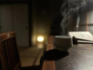 a coffee cup sitting on top of a wooden table at sikari Vacation STAY 95401v in Takashima