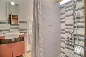 a bathroom with a shower and a sink at L'abri de la chouette in Langonnet +27 photos