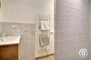 a bathroom with a sink and a shower at Le refuge des oiseaux in Langonnet +37 photos