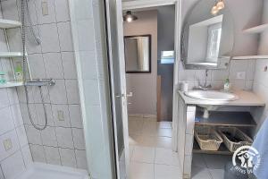 a bathroom with a shower and a sink at Le clos rucharet in Saint-Carreuc +20 photos