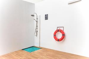 a room with a red life preserver on a wall at Citin Armoni Patong Hotel by Compass Hospitality - Newly Renovated in Patong Beach
