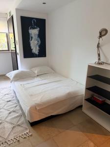 a bedroom with a large bed in a room at Апартаменты в Вари in Vari