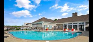 a large swimming pool in front of a house at Regatta Getaway in Fayetteville