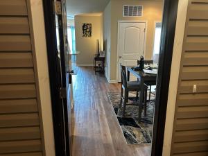 a dining room and living room with a table and chairs at Regatta Getaway in Fayetteville