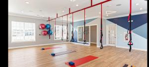 a gym with a bunch of pilates equipment at Regatta Getaway in Fayetteville