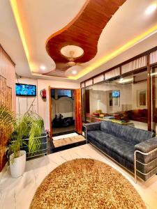 a living room with a couch and a rug at Shiv Dham Palace in Varanasi