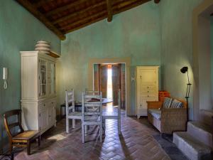 a living room with a table and a dining room at Casas da Estação, Country Houses in Marvão