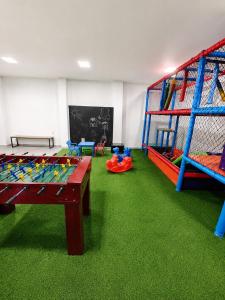 a play room with a ping pong table at Pousada Safari in Penha