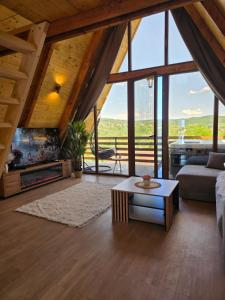 a living room with a couch and a table at Vila Mila in Vlaška