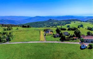 an aerial view of a house in a green field at Elegant Apprt in Lachamp-Raphaël