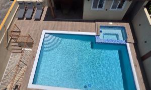an overhead view of a swimming pool on a building at Sorina's Apartments in Ocho Rios