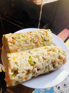 two slices of rice cake on a white plate at Rekawa Edge Homestay in Netolpitiya