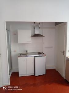 an empty kitchen with a sink and a counter at GautierNice in Nice
