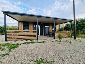 a small house with a blue roof at Sea Mobile Home in Sukošan +10 photos
