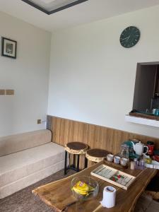 a living room with a couch and a table at Mariner Lodge Skardu in Skardu