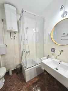 a bathroom with a shower and a sink and a toilet at Garden House Tučepi in Tučepi +13 photos