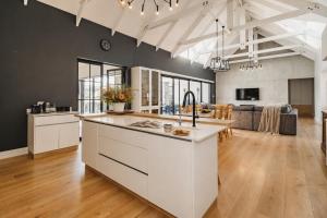 an open kitchen and living room with a kitchen island at Moorlands Manor in George