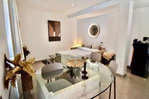 a living room with a glass table and a couch at Diasof Apartments in Rome