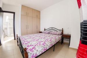a bedroom with a bed and a desk in a room at Paliouri Villas in Paliouri