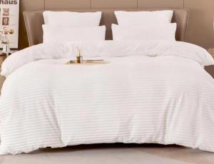a white bed with a white blanket on it at Soshanguve Lux Accom Room 03 in Soshanguve +7 photos