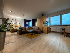 a living room with a couch and a table at L69 Apartments - Angel's Apartment in Banská Bystrica