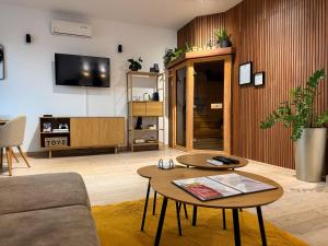 a living room with a couch and a table at L69 Apartments - Angel's Apartment in Banská Bystrica