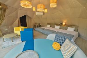 a bedroom with two beds in a tent at Pleasure Resort Izu Akazawa Onsen in Ito +185 photos