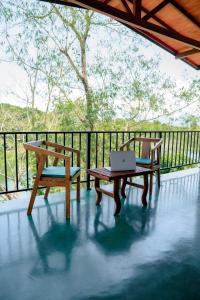 two benches sitting on a porch with a laptop at Circle Edge Resort in Kandy +12 photos