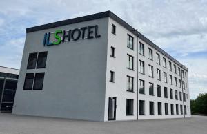 a building with a sign on the side of it at ILS Hotel by WMM Hotels in Ilsfeld