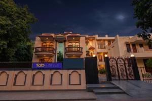 a building with a sign in front of it at FabHotel The Arjun Sushant lok - Iffco Chowk Sector 29 in Gurgaon