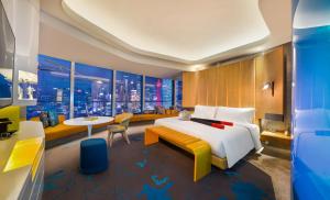 a hotel room with a large bed and a table at W Shanghai - The Bund in Shanghai +84 photos