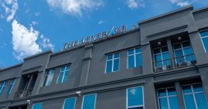 a gray building with a sign on top of it at The Leverage Business Hotel - Rawang in Rawang