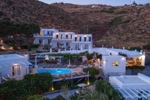 an aerial view of a villa with a swimming pool at Rhenia Mykonos Hotel & Bungalows in Tourlos