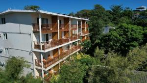 an apartment building with balconies on the side of it at Boracay Amor Apartment in Boracay