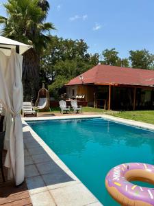 a swimming pool with an inflatable at Habitación Suite in Chimbarongo